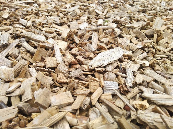 a pile of wood chips sitting on top of a wooden floor